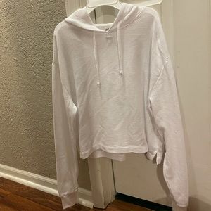hooded pink sweatshirt in the color white never worn